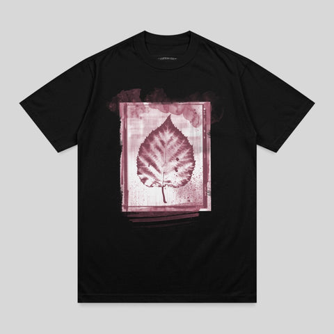 Black t-shirt with a framed, reddish-brown leaf print and subtle watercolor-like background.