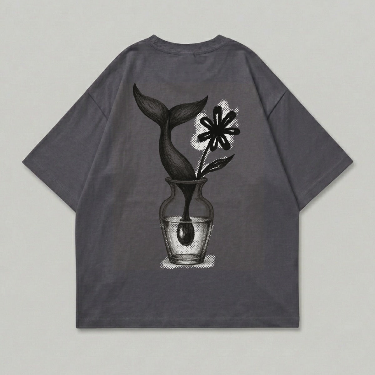 Gray t-shirt with a vase holding a flower and a whale tail.