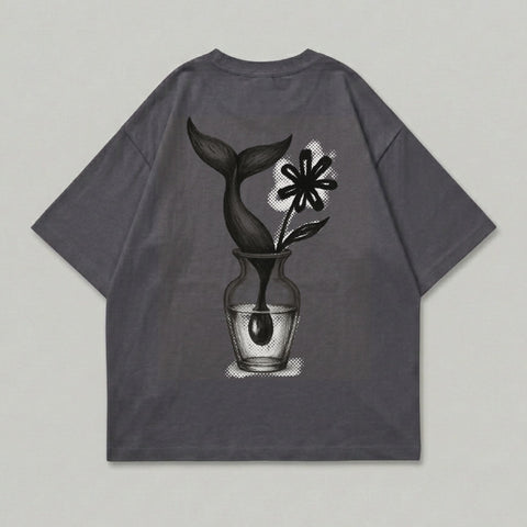 Gray t-shirt with a vase holding a flower and a whale tail.