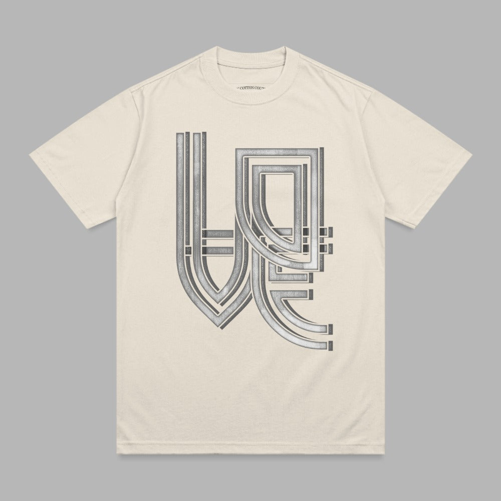 Cream t-shirt with a silver geometric "WE" logo design.