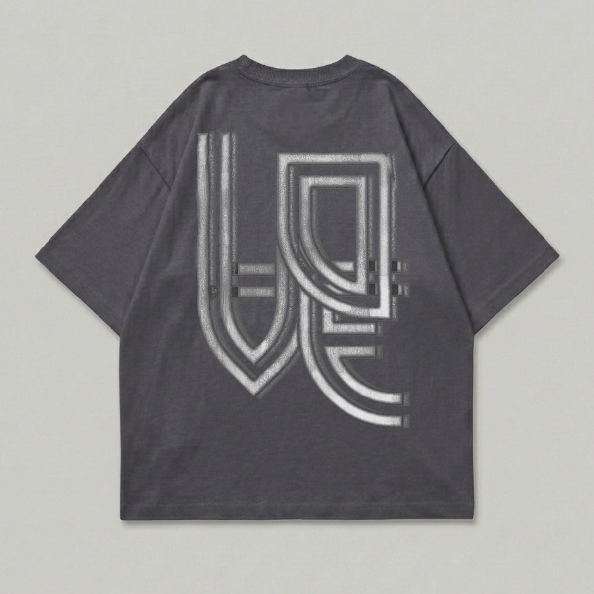 Charcoal t-shirt with a metallic, embossed geometric design on the back.