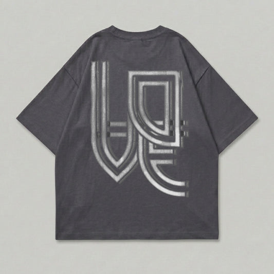 Charcoal t-shirt with a metallic, embossed geometric design on the back.