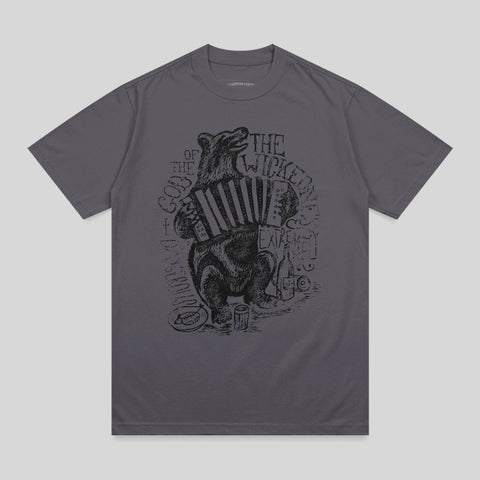 Bear playing accordion and drinking from bottle, on dark gray t-shirt.