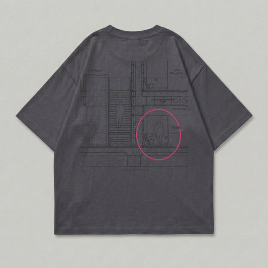 Dark grey t-shirt with a blueprint-style graphic of figures in a hallway and restroom.