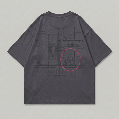 Dark grey t-shirt with a blueprint-style graphic of figures in a hallway and restroom.