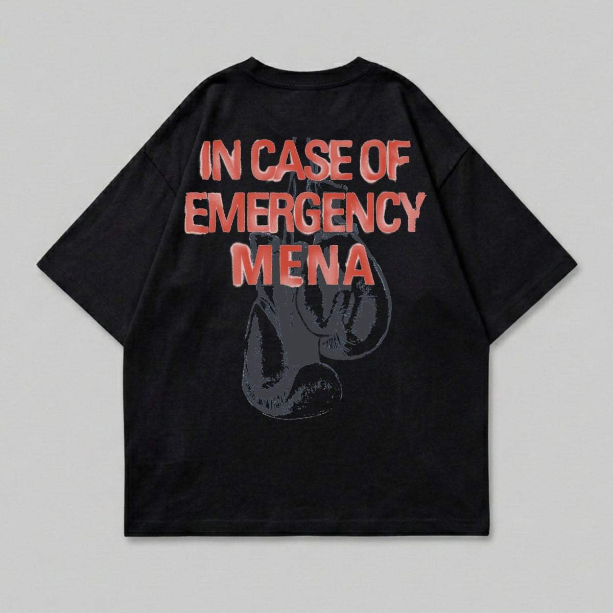 Black t-shirt with red text "IN CASE OF EMERGENCY MENA" and boxing gloves graphic.