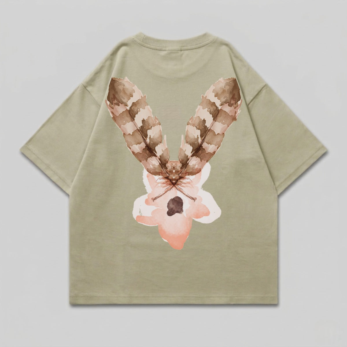 Tan t-shirt with a watercolor-style feather and flower design on the back.