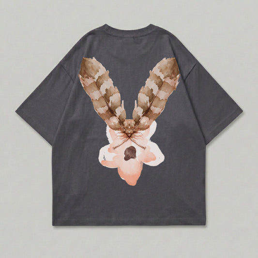Dark grey t-shirt with a watercolor moth and flower design on the back.