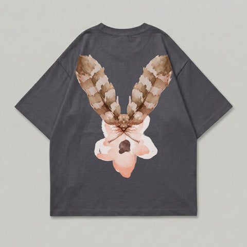 Dark grey t-shirt with a watercolor moth and flower design on the back.