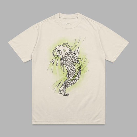 Cream t-shirt with black outline of a koi fish and green abstract shapes.