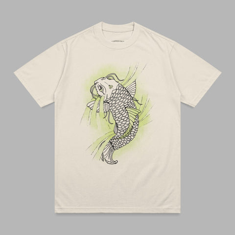 Cream t-shirt with black outline of a koi fish and green abstract shapes.
