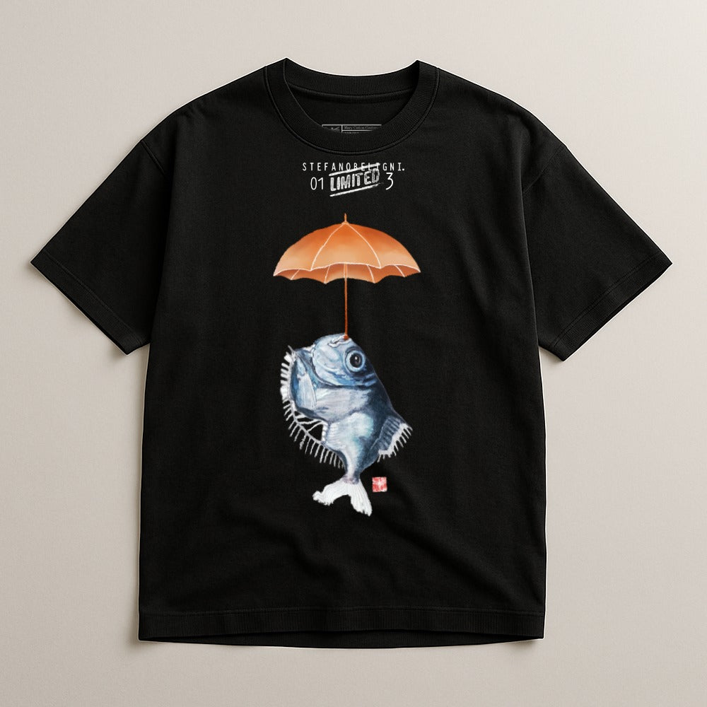 Black t-shirt with a watercolor illustration of a fish holding an orange umbrella.