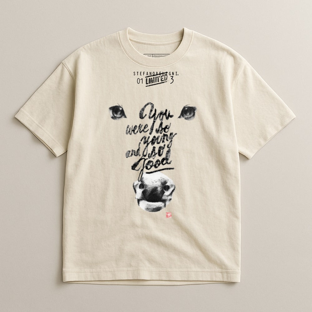 Cream t-shirt with stylized eyes, nose, and text "You were so young and so good."