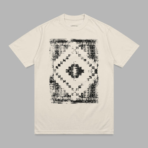Cream t-shirt with black distressed geometric diamond graphic.