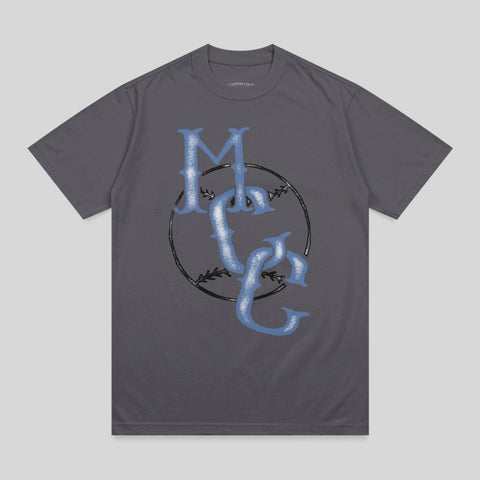 Grey t-shirt with blue "MC" logo and baseball stitching.