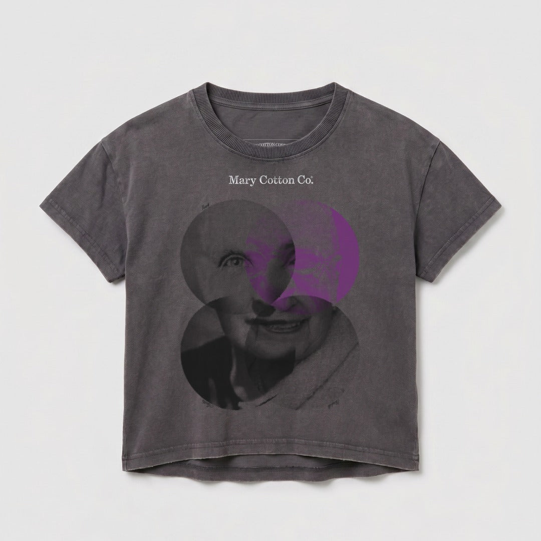 Grey t-shirt with graphic design of a portrait overlaid with purple circles.