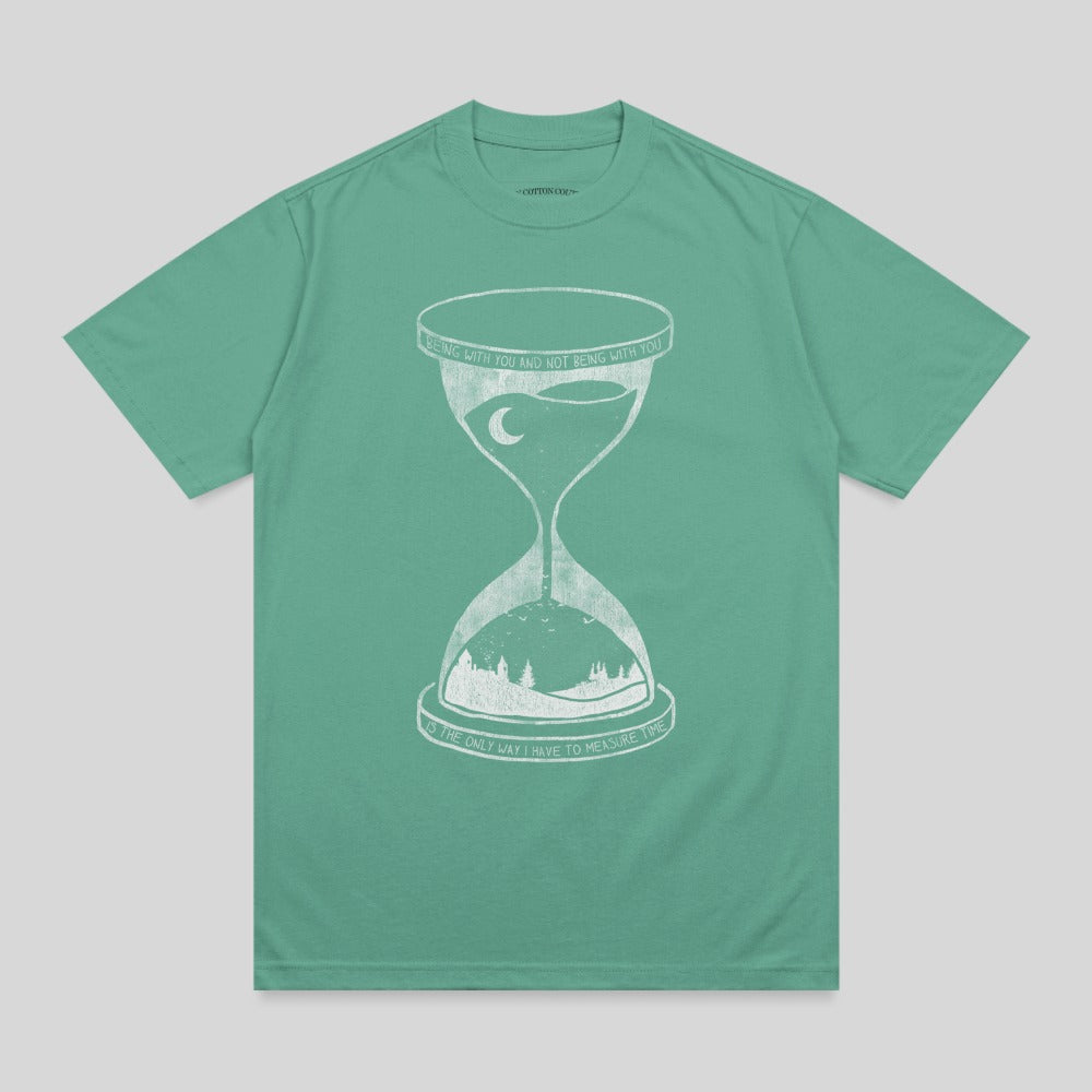 Green t-shirt with hourglass graphic and text "Being with you and not being with you is the only way I have to measure time."