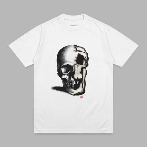 White t-shirt with a split graphic of a skull and a nude figure.