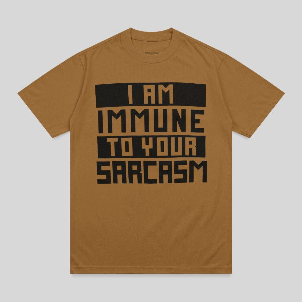 Brown t-shirt with black text reading "I AM IMMUNE TO YOUR SARCAST."