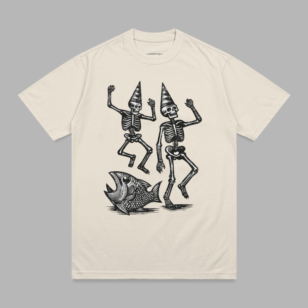 Two skeletons in party hats dance next to a large fish.