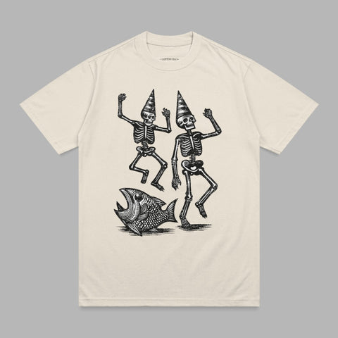 Two skeletons in party hats dance next to a large fish.