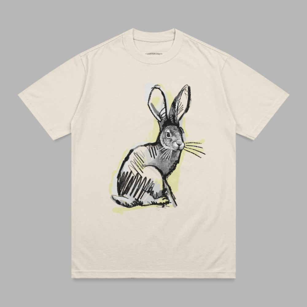 Cream t-shirt with a sketched rabbit illustration.