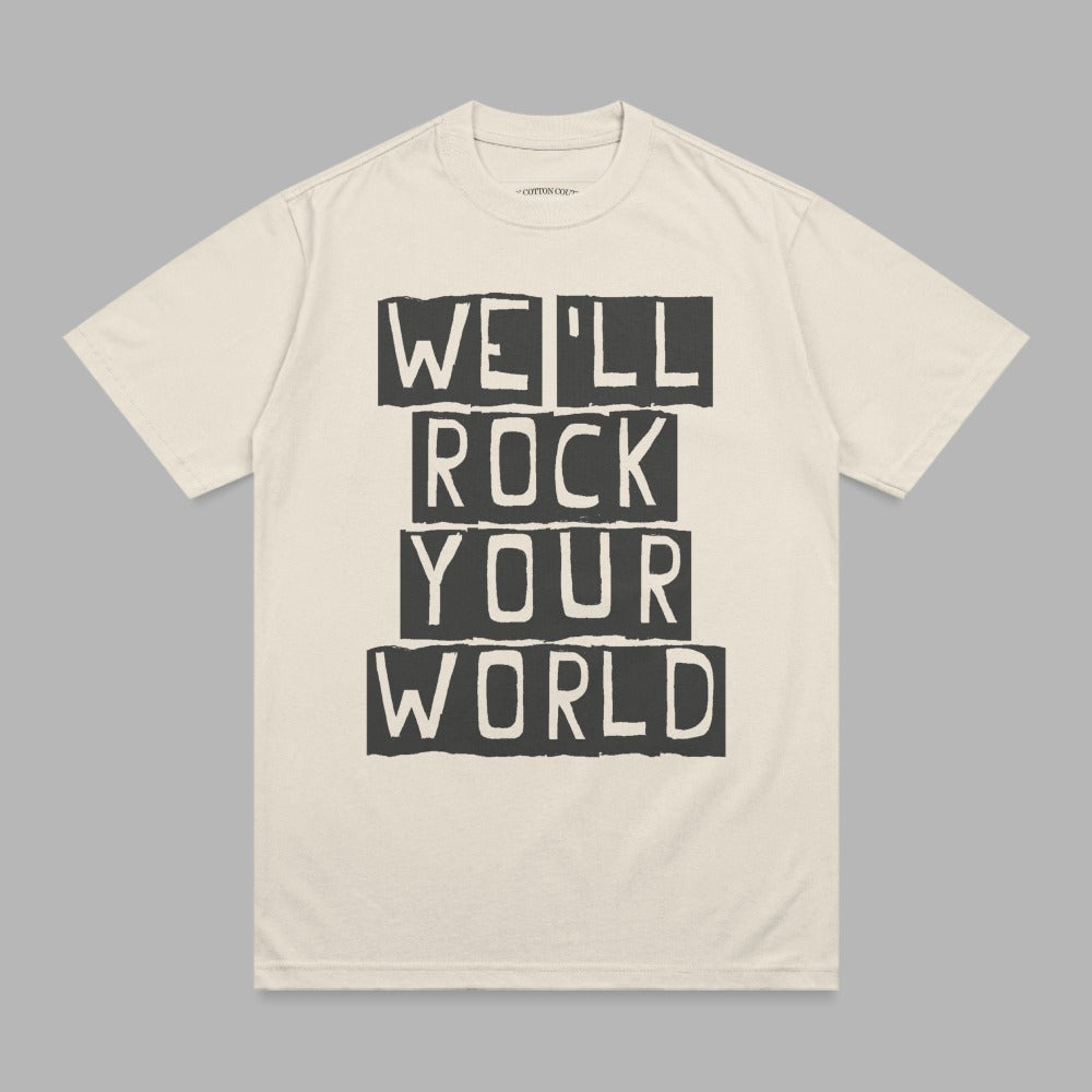 Cream t-shirt with "WE'LL ROCK YOUR WORLD" in black block letters.