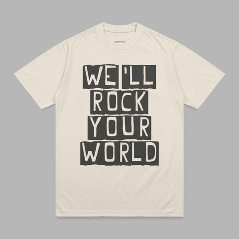 Cream t-shirt with "WE'LL ROCK YOUR WORLD" in black block letters.