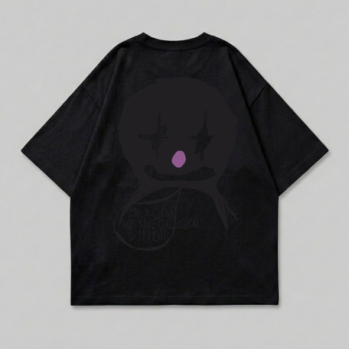 Black t-shirt with a circular purple and pink clown face graphic and text.