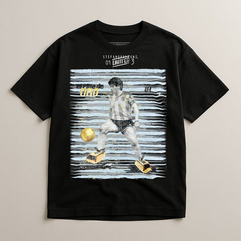 Black t-shirt with graphic of Diego Maradona playing soccer.