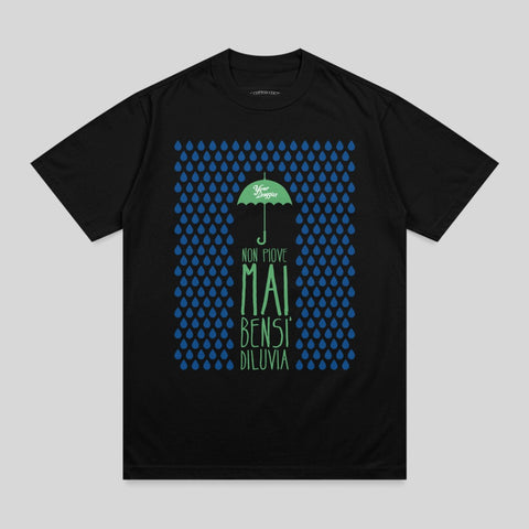 Black t-shirt with green raining umbrella and Italian text "Non piove mai, bensi diluvia."