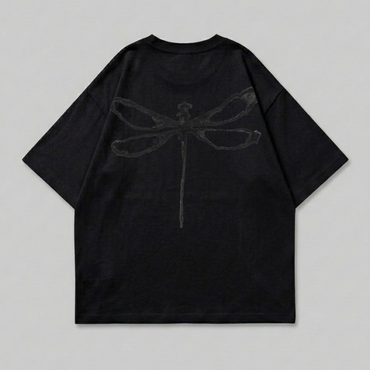 Black t-shirt with a dark gray dragonfly graphic on the back.