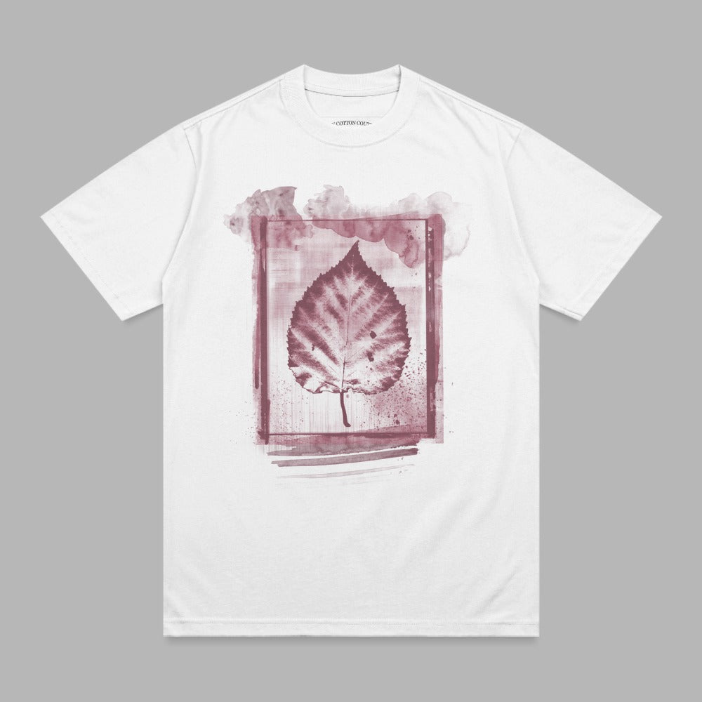 White t-shirt with a dark red leaf print within a watercolor-style frame.