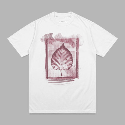White t-shirt with a dark red leaf print within a watercolor-style frame.