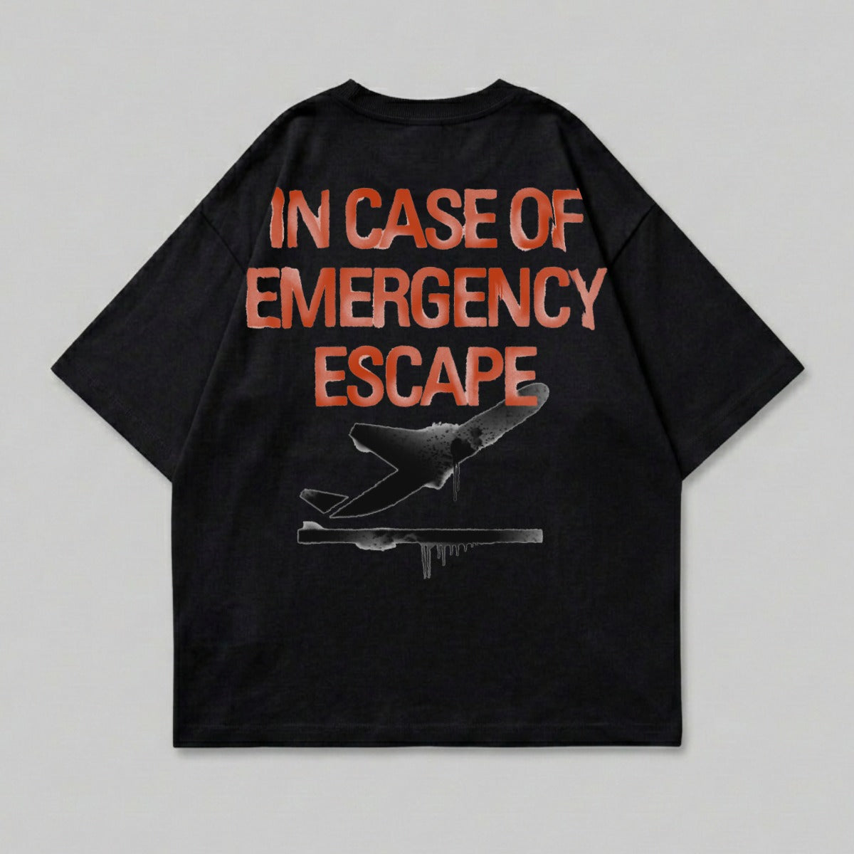 Black t-shirt with "IN CASE OF EMERGENCY ESCAPE" and airplane graphic.
