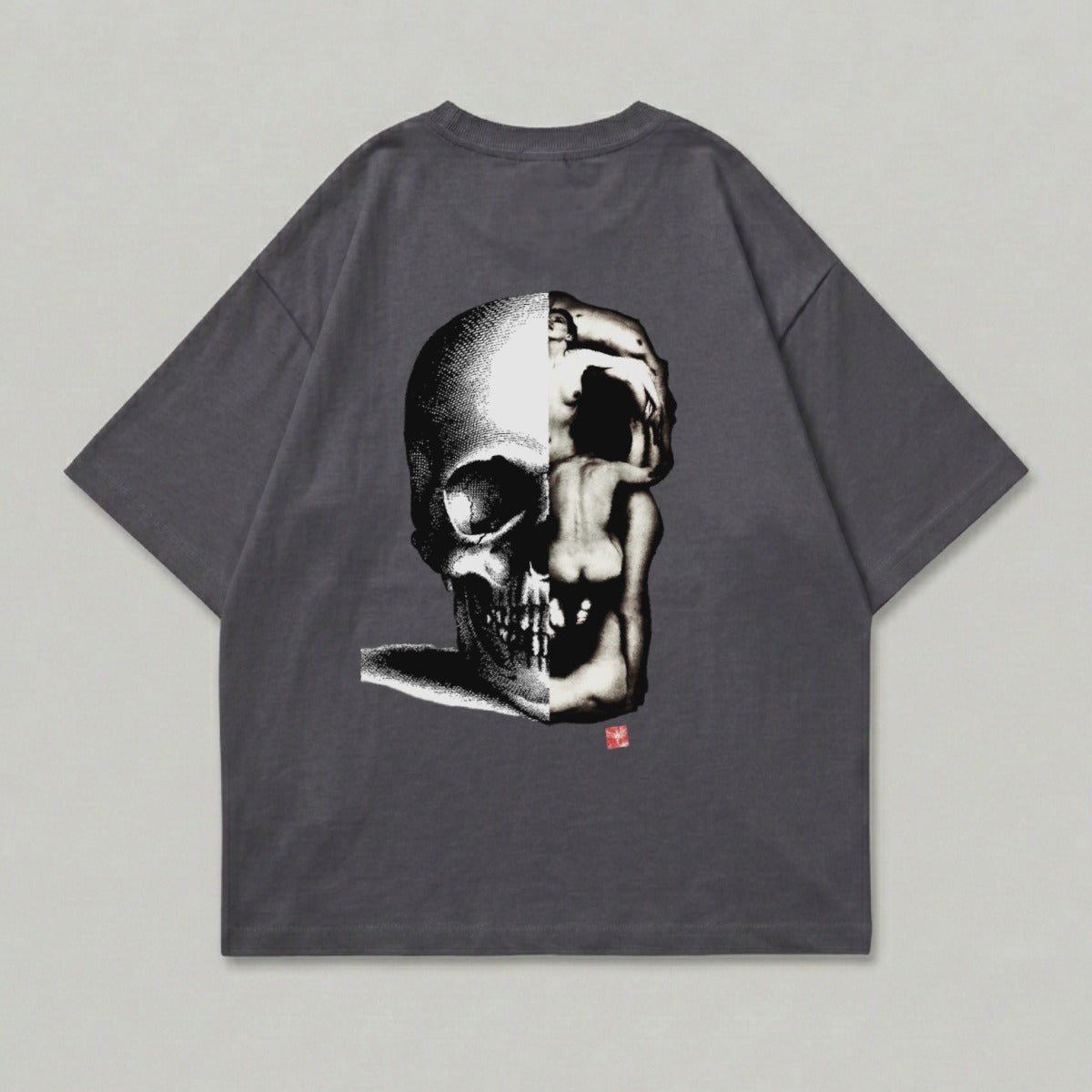 Dark grey t-shirt with a split skull and human figure graphic.