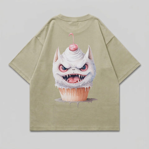 Green t-shirt with a cartoon cupcake monster graphic.