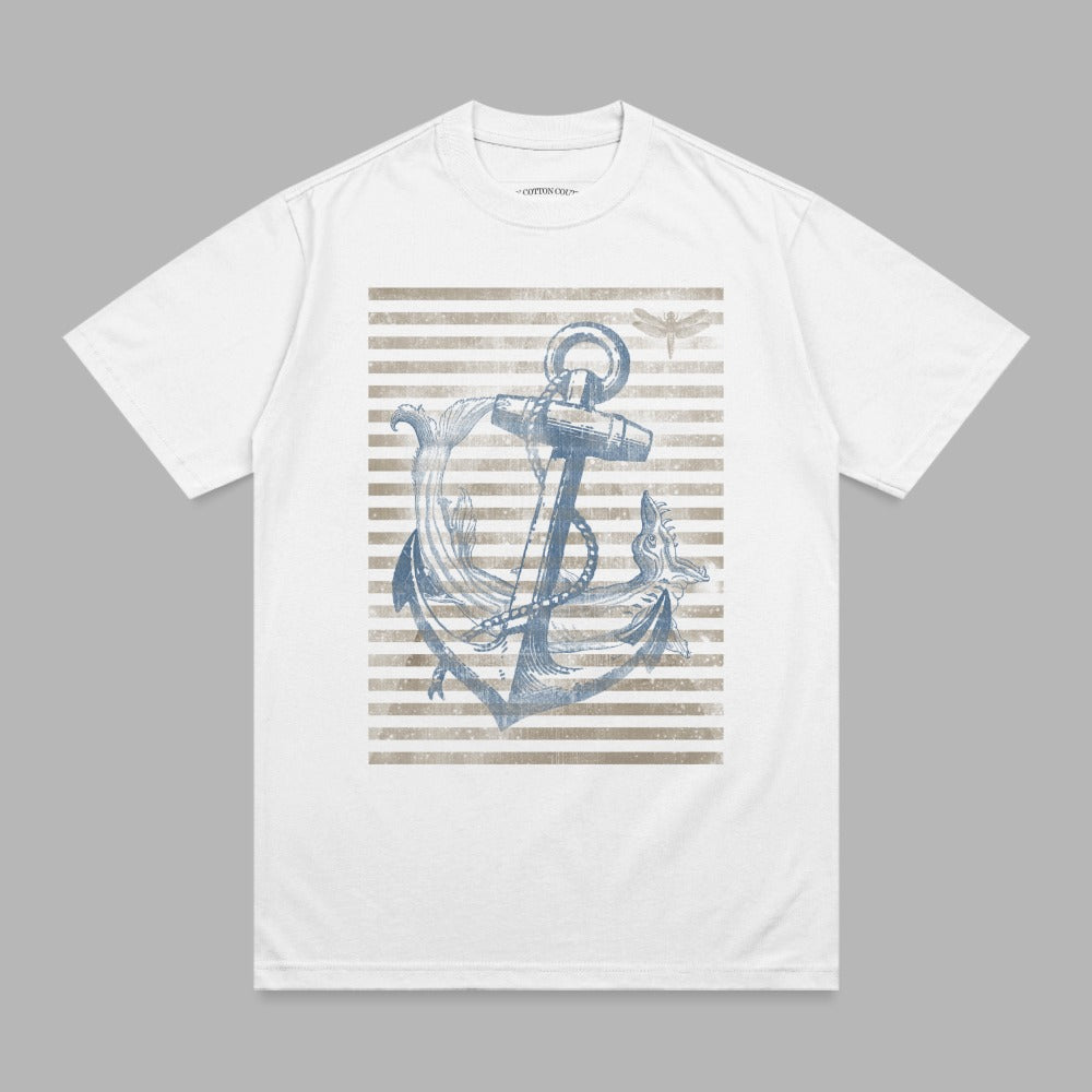 White t-shirt with distressed anchor and dragonfly graphic on striped background.