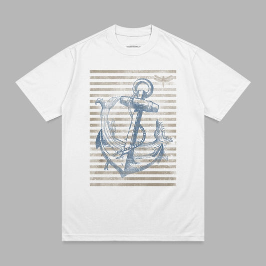 White t-shirt with distressed anchor and dragonfly graphic on striped background.