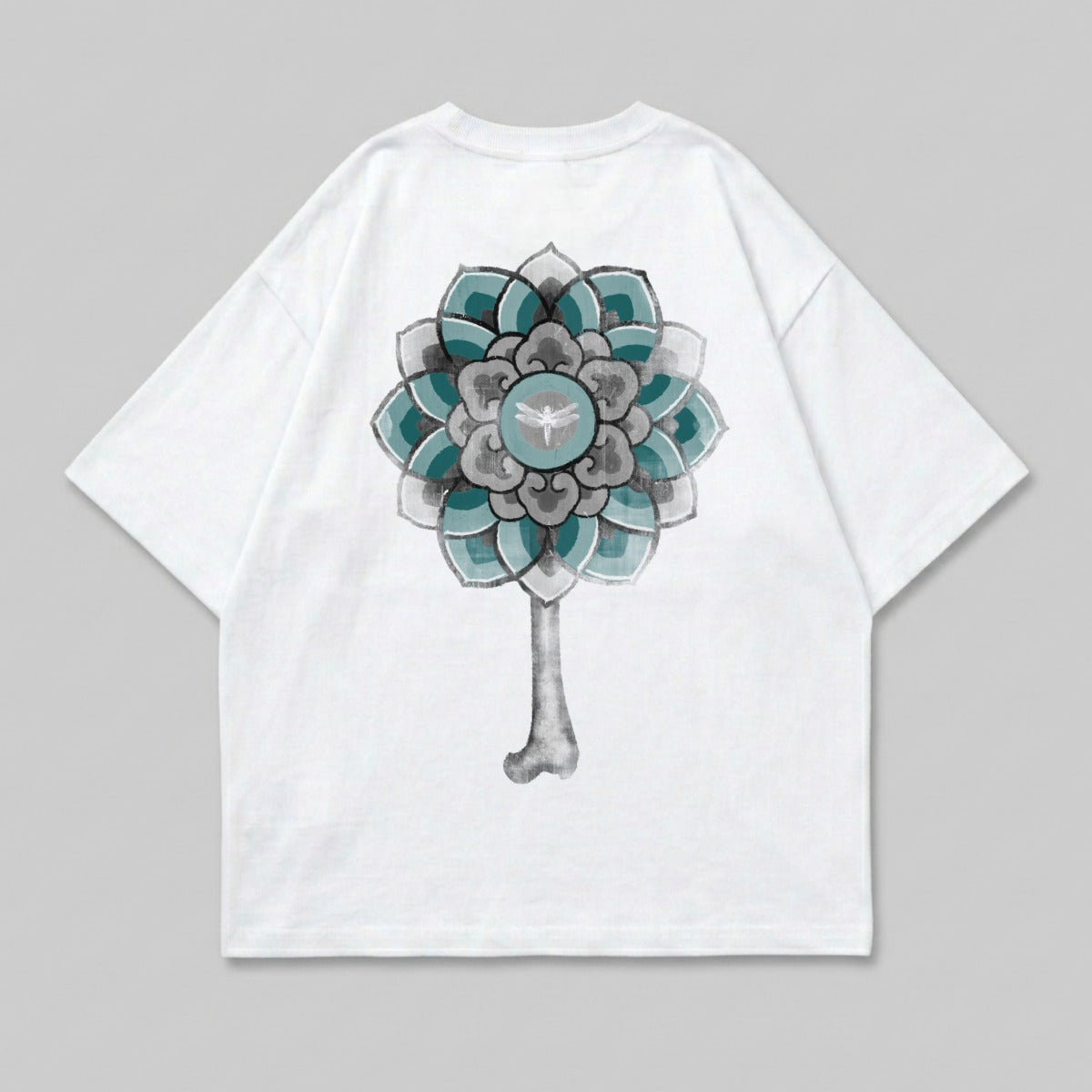 White t-shirt with a blue and gray mandala-like floral design on the back.