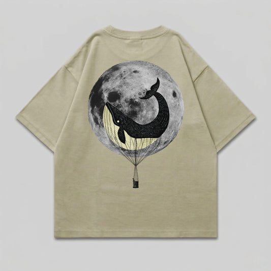 T-shirt with a black whale in a hot air balloon against a full moon.