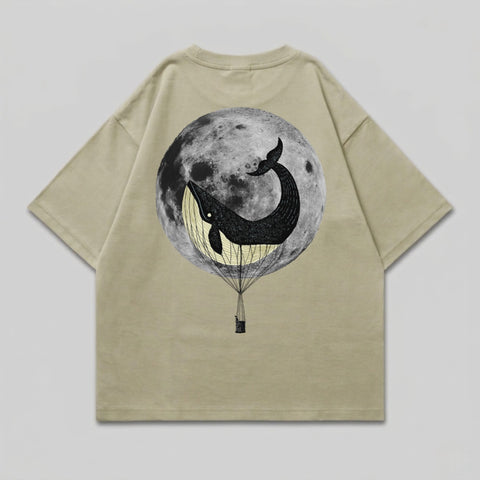 T-shirt with a black whale in a hot air balloon against a full moon.
