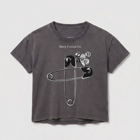 Gray t-shirt with large safety pins and graphic elements.