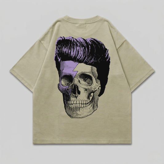 Tan t-shirt with a skull and purple lightning bolt graphic on the back.
