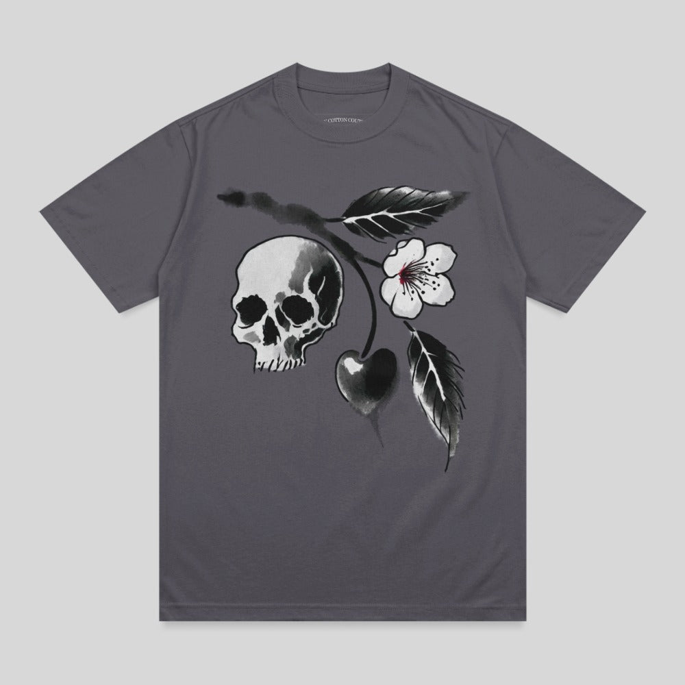T-shirt featuring a watercolor skull, cherry, and flower design.
