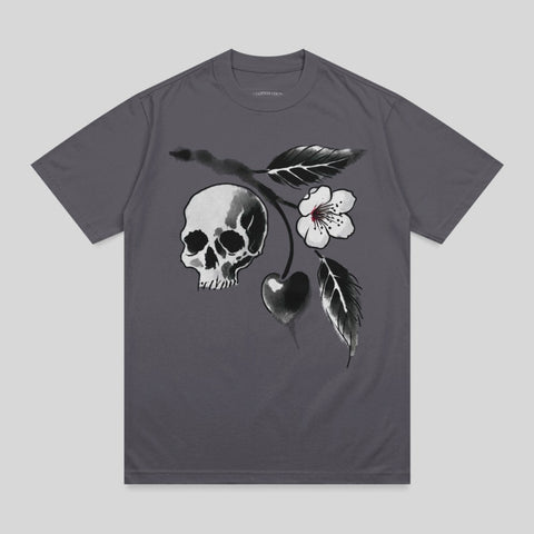 T-shirt featuring a watercolor skull, cherry, and flower design.