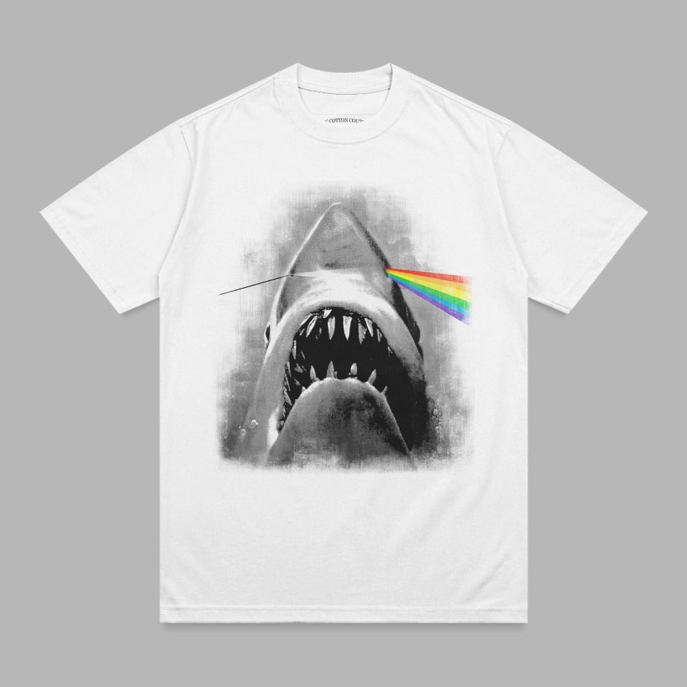 White t-shirt featuring a shark with rainbow light prism through its head.