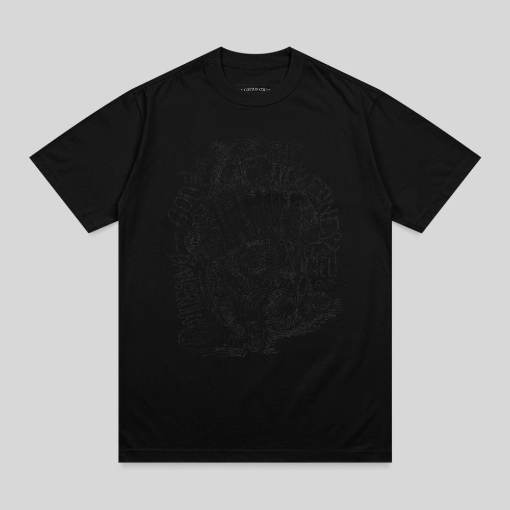 Black t-shirt with faded, intricate skull and flower graphic on front.