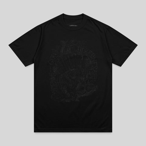 Black t-shirt with faded, intricate skull and flower graphic on front.
