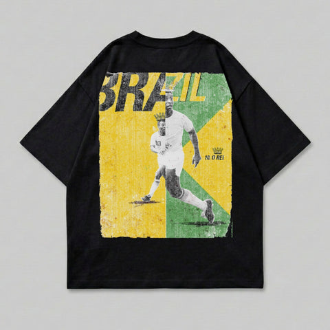 Black t-shirt with "BRAZIL" text and a soccer player on a distressed yellow and green background.